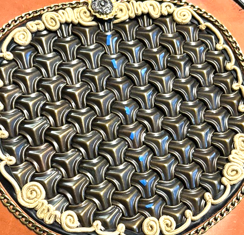 Modern reconstruction of Y-shaped iron units interlocked into a continuous armor surface