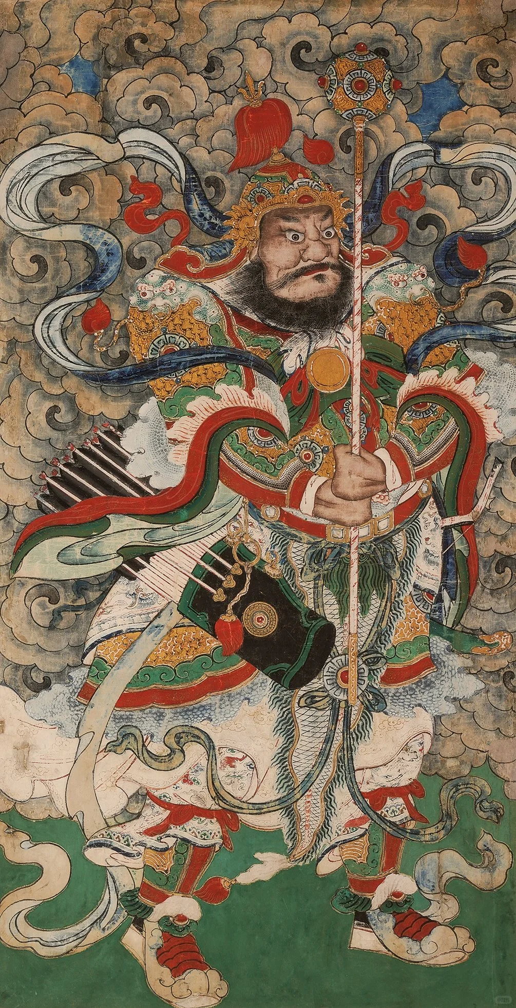 Central fish-tail pendant in the frontal armor of a martial figure