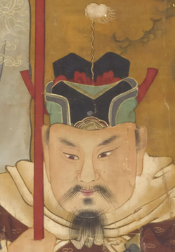 A frontal view of a high rigid military Futou with fixed side feet and a white top ornament.