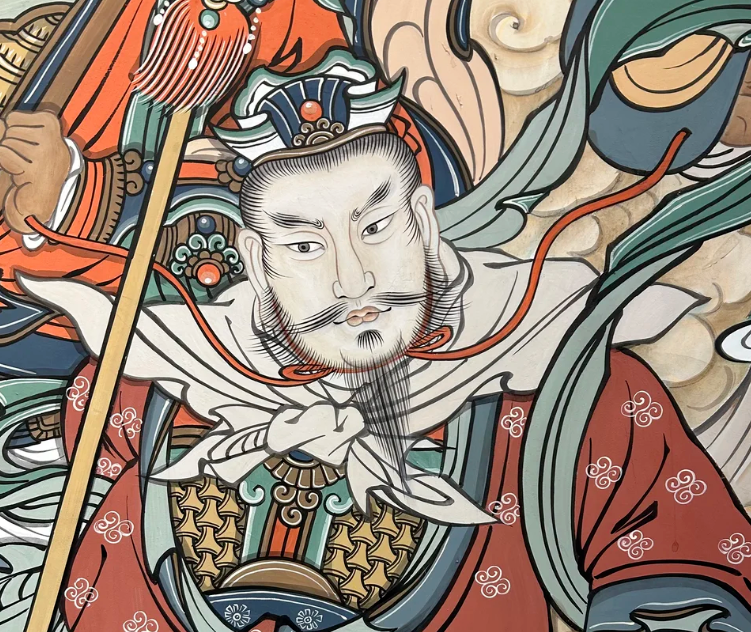 Short shoulder scarf tied at the front above the armor of a martial figure